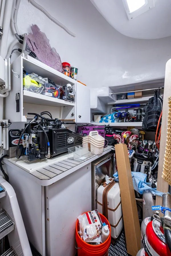 A well-organized storage area with various equipment and supplies neatly arranged. aboard LILA CUY Yacht for Sale