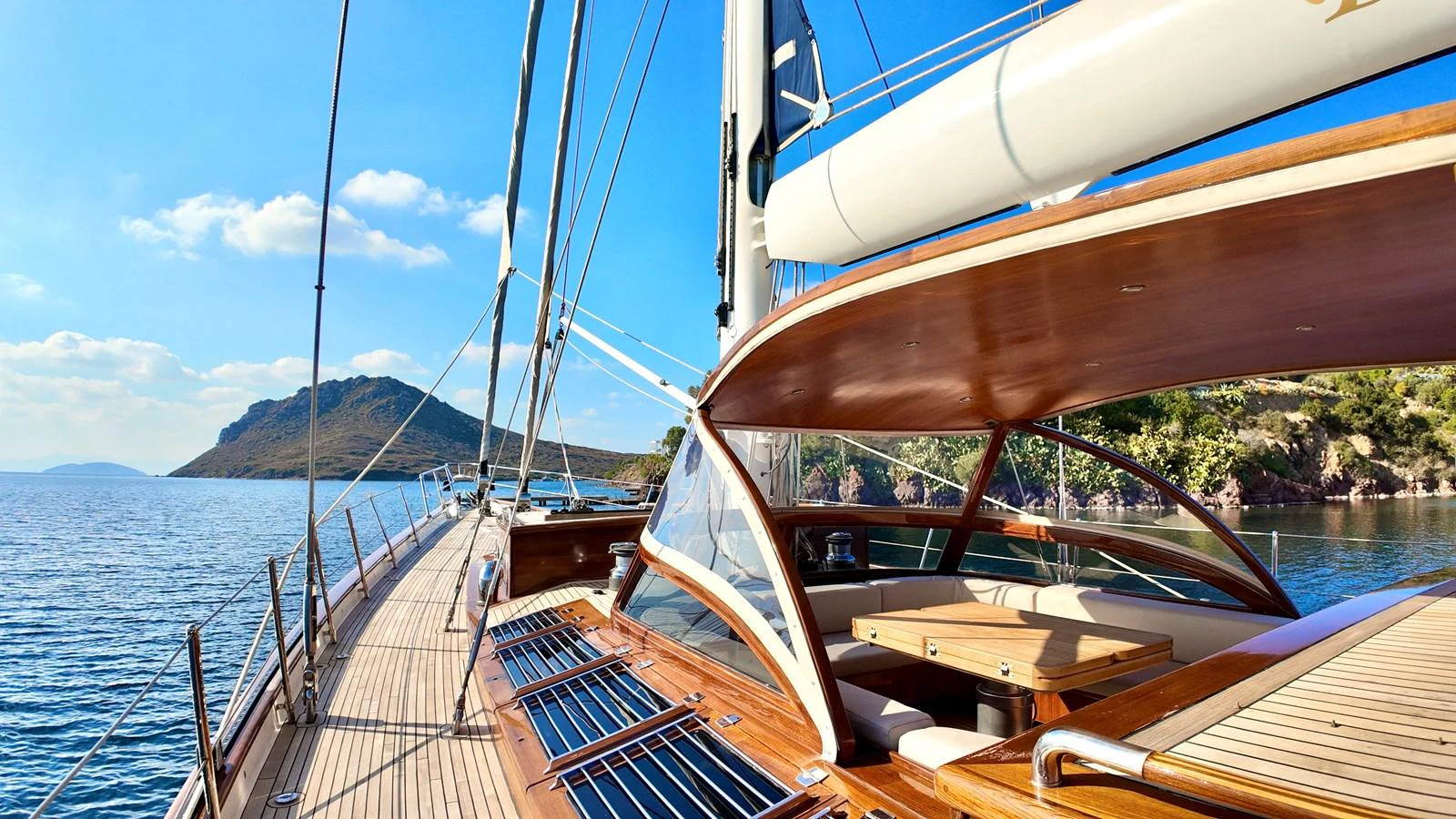 The yacht's deck offers a stunning view of the surrounding waters and landscape. aboard PORTOBELLO Yacht for Sale