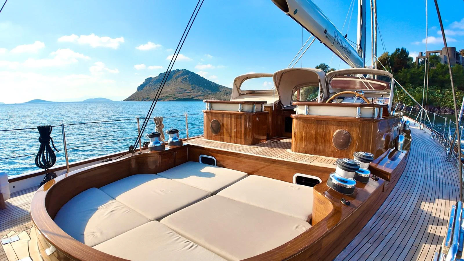 The yacht's deck offers a spacious and inviting area for relaxation with stunning views of the surrounding waters and landscape. aboard PORTOBELLO Yacht for Sale
