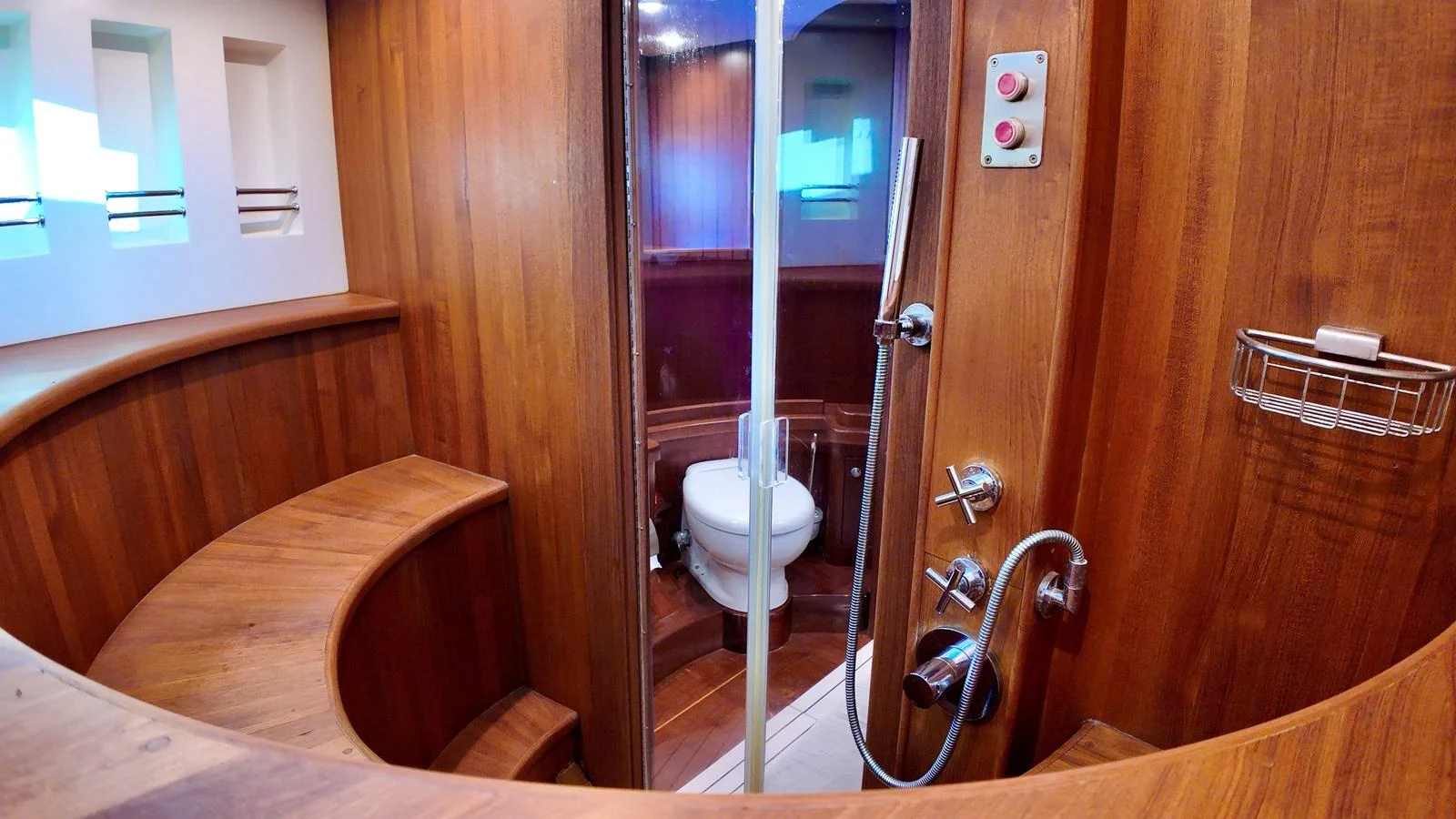 The yacht's bathroom features elegant wood paneling and modern fixtures. aboard PORTOBELLO Yacht for Sale