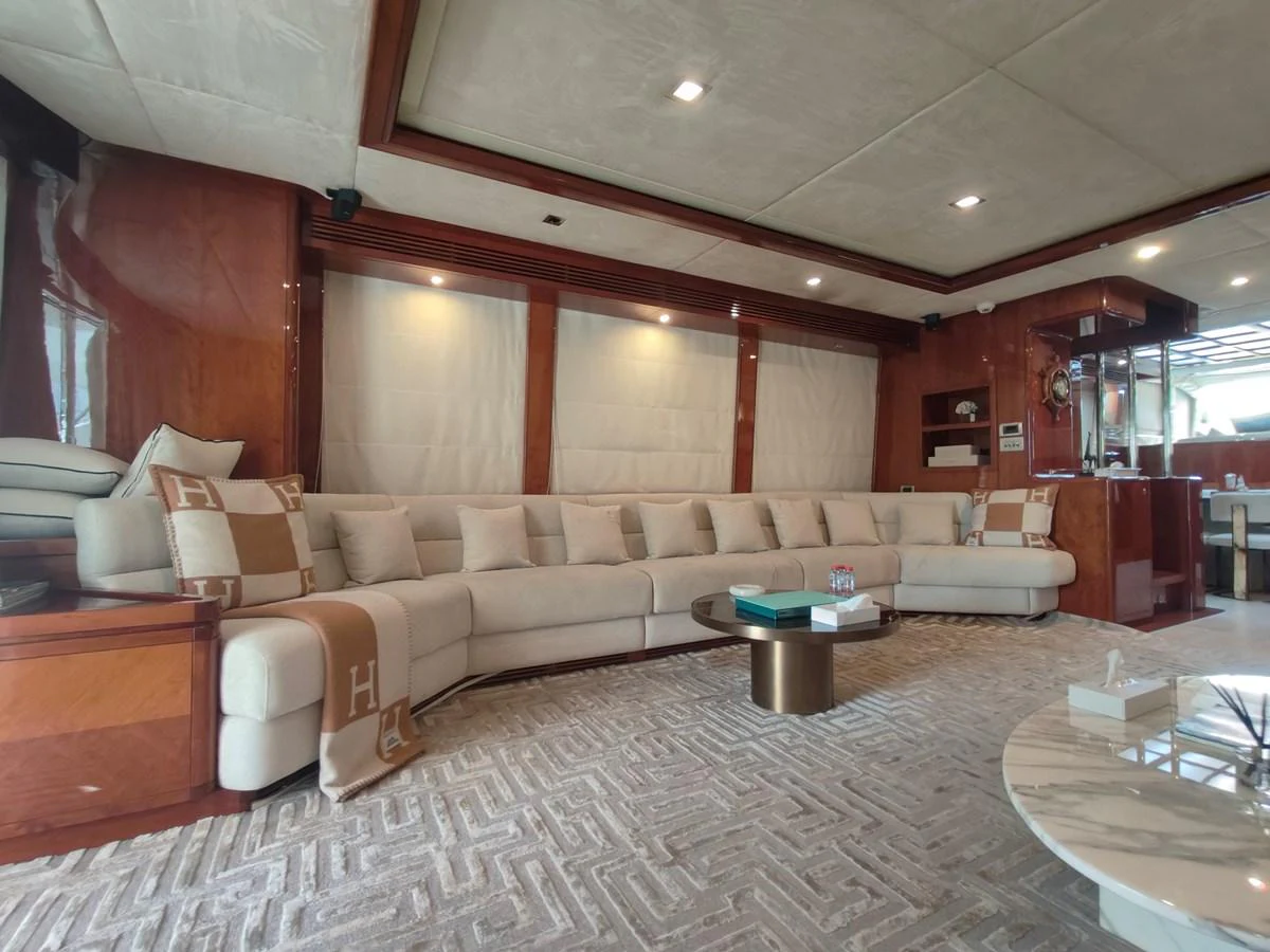 a living room with a couch and a table aboard HERMAS Yacht for Sale
