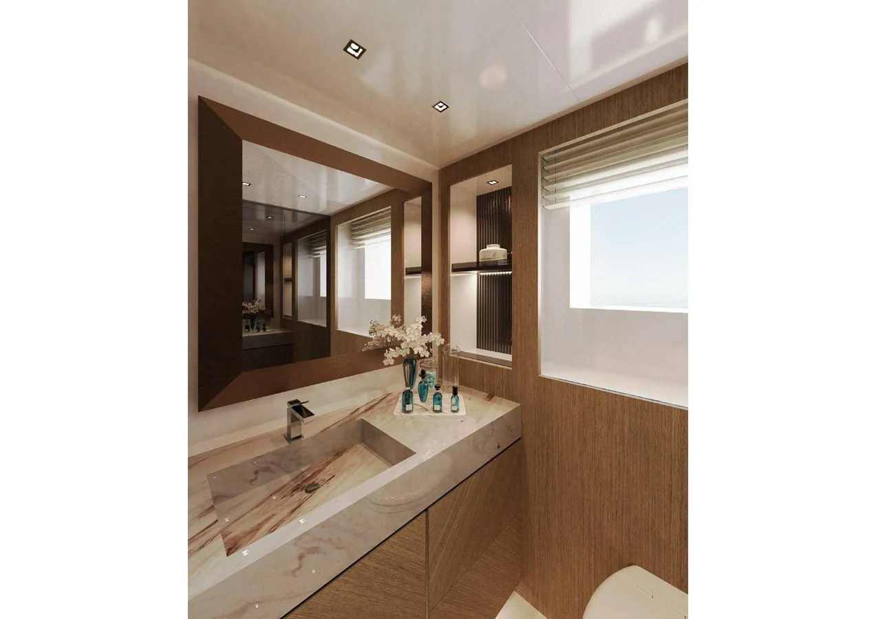 A luxurious yacht bathroom featuring a sleek vanity and large mirror, bathed in natural light. aboard MANGUSTA OCEANO 44, #8 Yacht for Sale