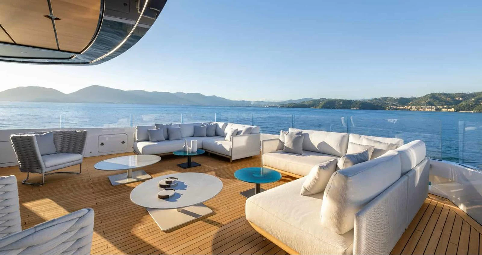 The aft deck features luxurious seating with stunning ocean views. aboard MANGUSTA OCEANO 44, #8 Yacht for Sale