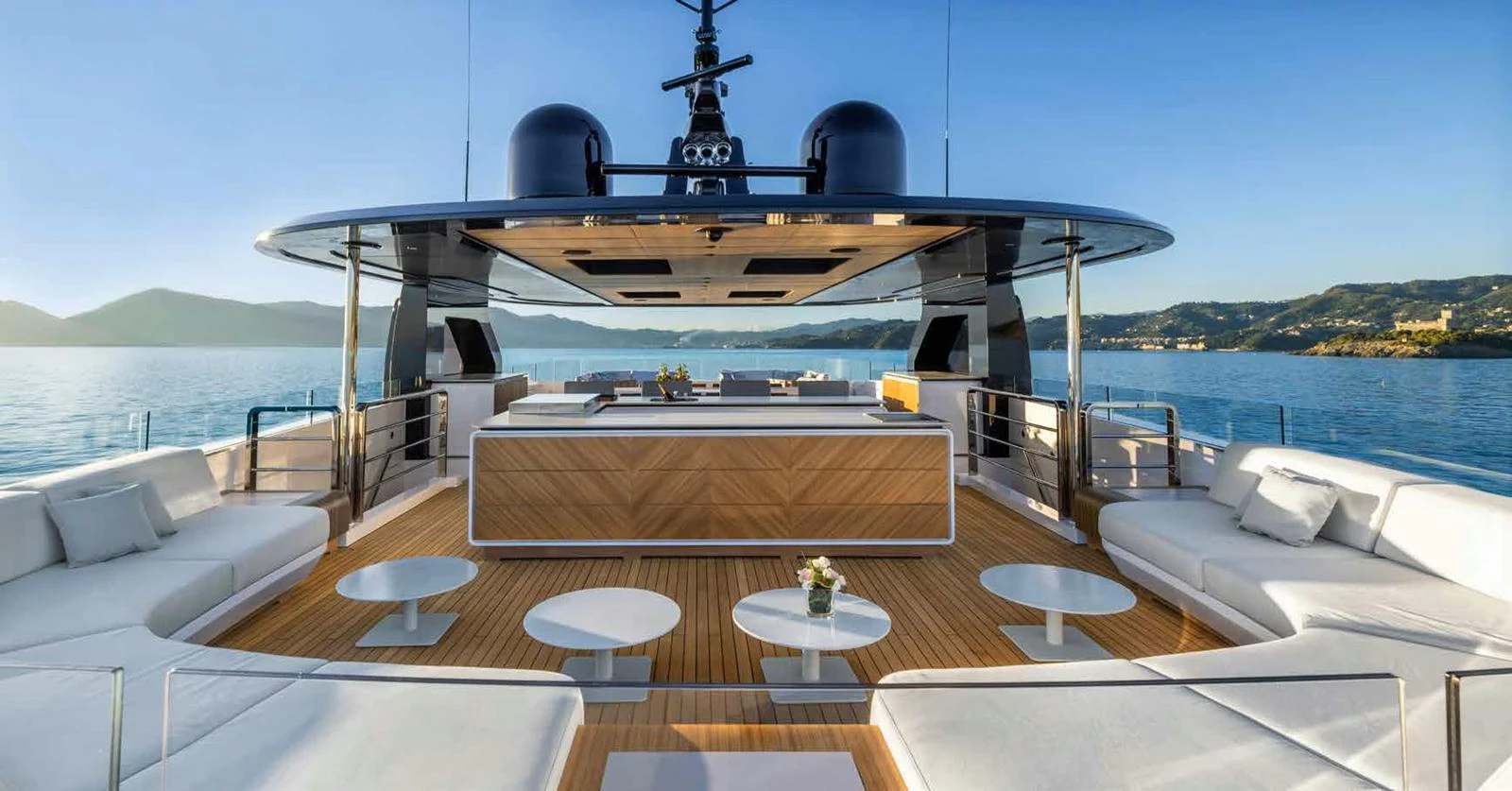 The yacht's aft deck features luxurious seating and a stylish bar area, perfect for relaxation and entertainment. aboard MANGUSTA OCEANO 44, #8 Yacht for Sale
