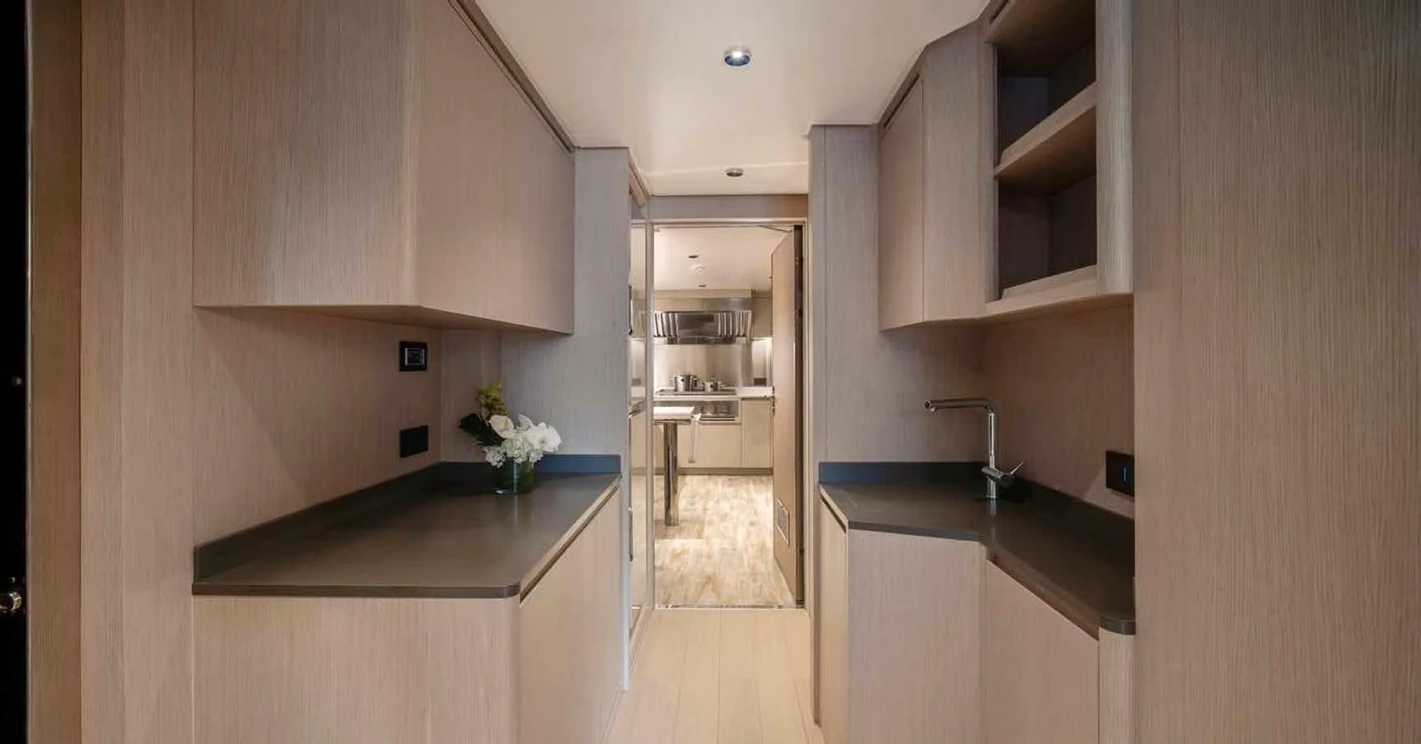 The yacht's galley features modern cabinetry and ample counter space, creating a sleek and functional cooking area. aboard MANGUSTA OCEANO 44, #8 Yacht for Sale