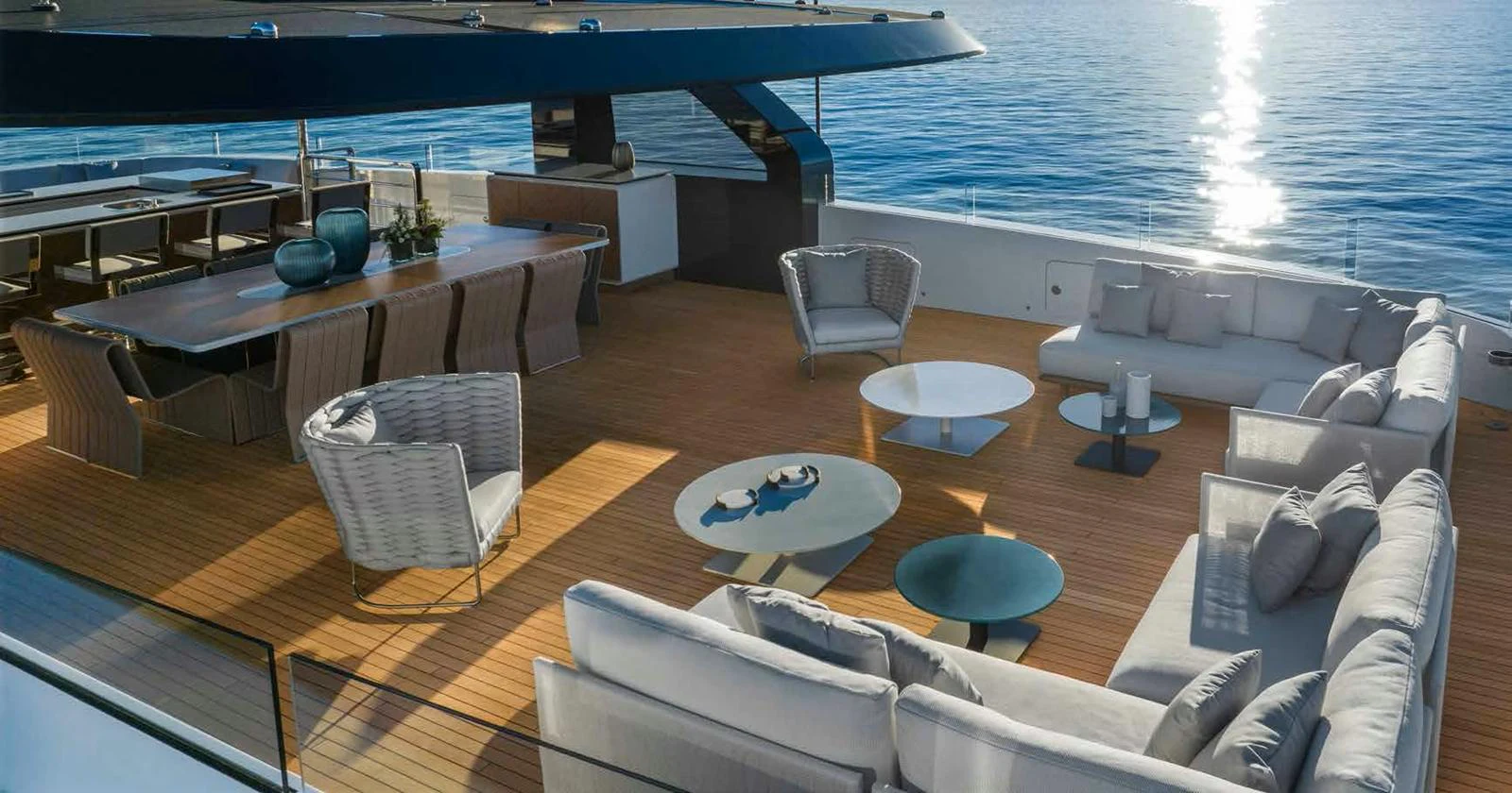 The aft deck offers a luxurious outdoor living space with comfortable seating and a dining area, perfect for enjoying the ocean views. aboard MANGUSTA OCEANO 44, #8 Yacht for Sale