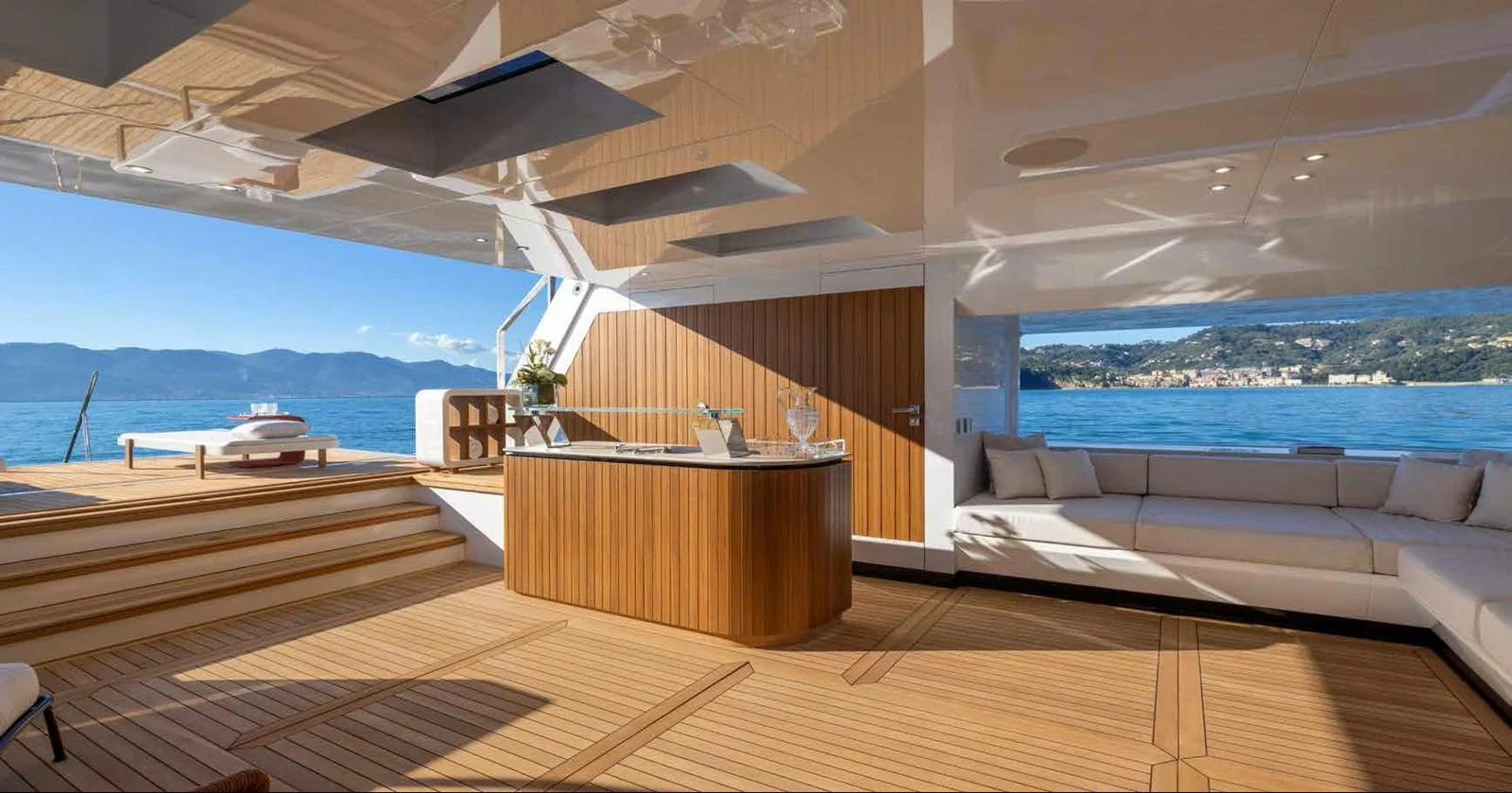 The aft deck features a stylish bar area with ample seating and stunning views of the water. aboard MANGUSTA OCEANO 44, #8 Yacht for Sale