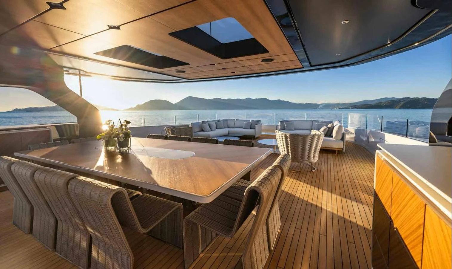 The aft deck offers a spacious and elegant outdoor dining area with stunning sea views. aboard MANGUSTA OCEANO 44, #8 Yacht for Sale
