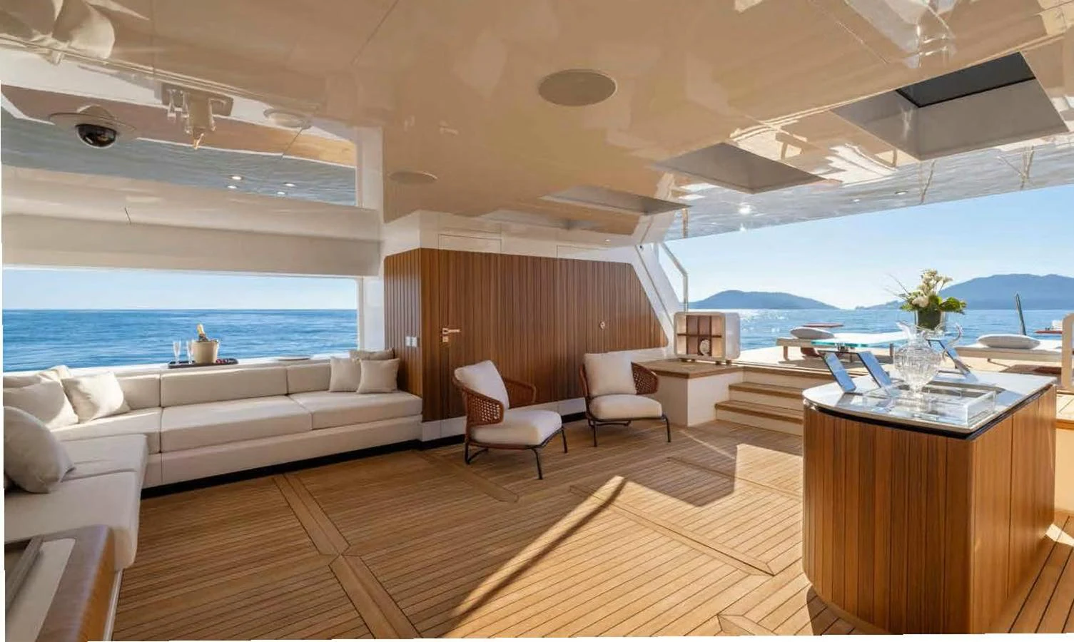 The aft deck features elegant seating and a stunning view of the sea. aboard MANGUSTA OCEANO 44, #8 Yacht for Sale