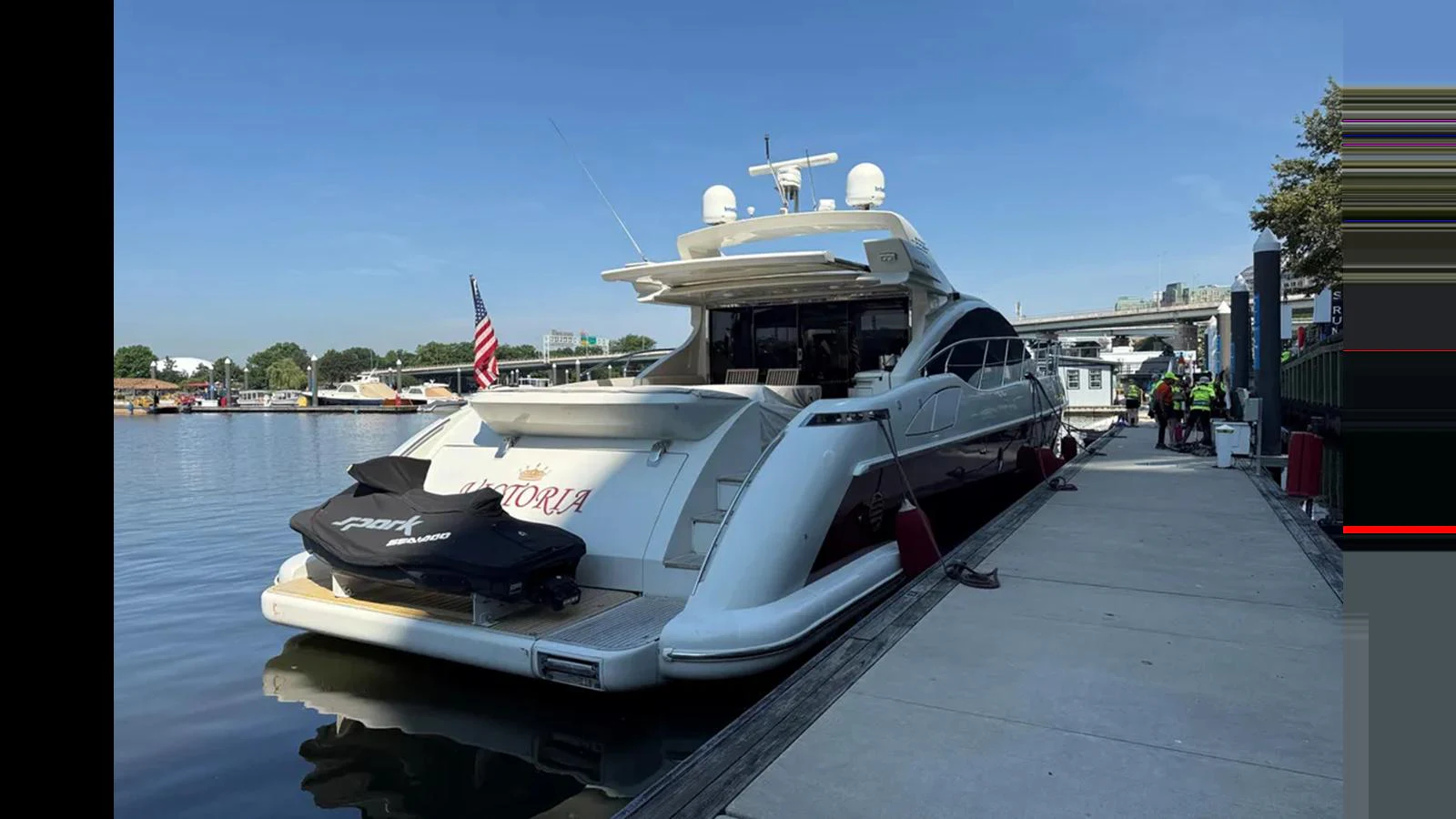 The yacht is docked at a marina, showcasing its sleek aft deck and modern design. aboard 2007 AZIMUT 68S Yacht for Sale