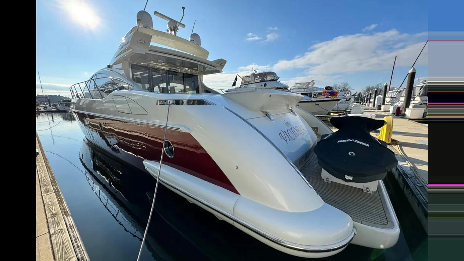A sleek and modern yacht docked at a marina, showcasing its elegant design and luxurious features. aboard 2007 AZIMUT 68S Yacht for Sale