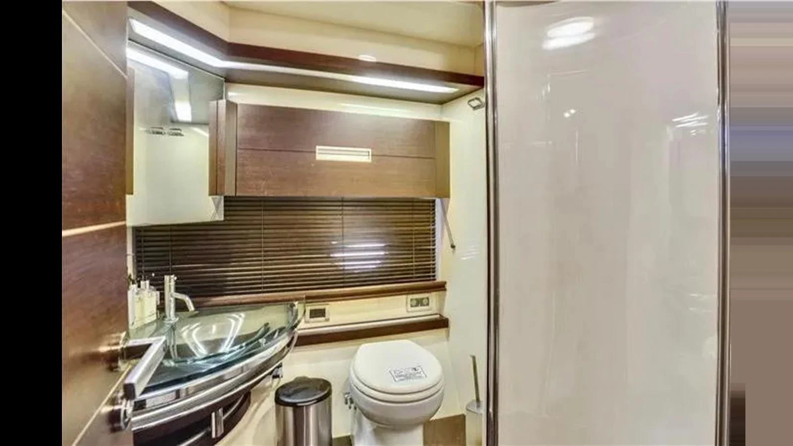 The yacht's bathroom features modern fixtures and a sleek design. aboard 2007 AZIMUT 68S Yacht for Sale