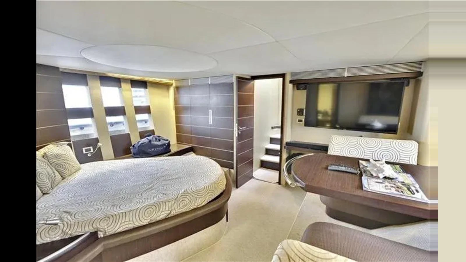 The stateroom features a comfortable bed, modern furnishings, and ample natural light. aboard 2007 AZIMUT 68S Yacht for Sale