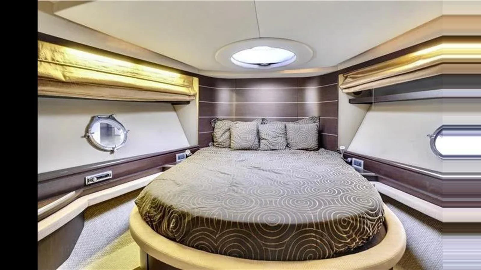 The stateroom features a cozy, well-lit sleeping area with modern design elements. aboard 2007 AZIMUT 68S Yacht for Sale