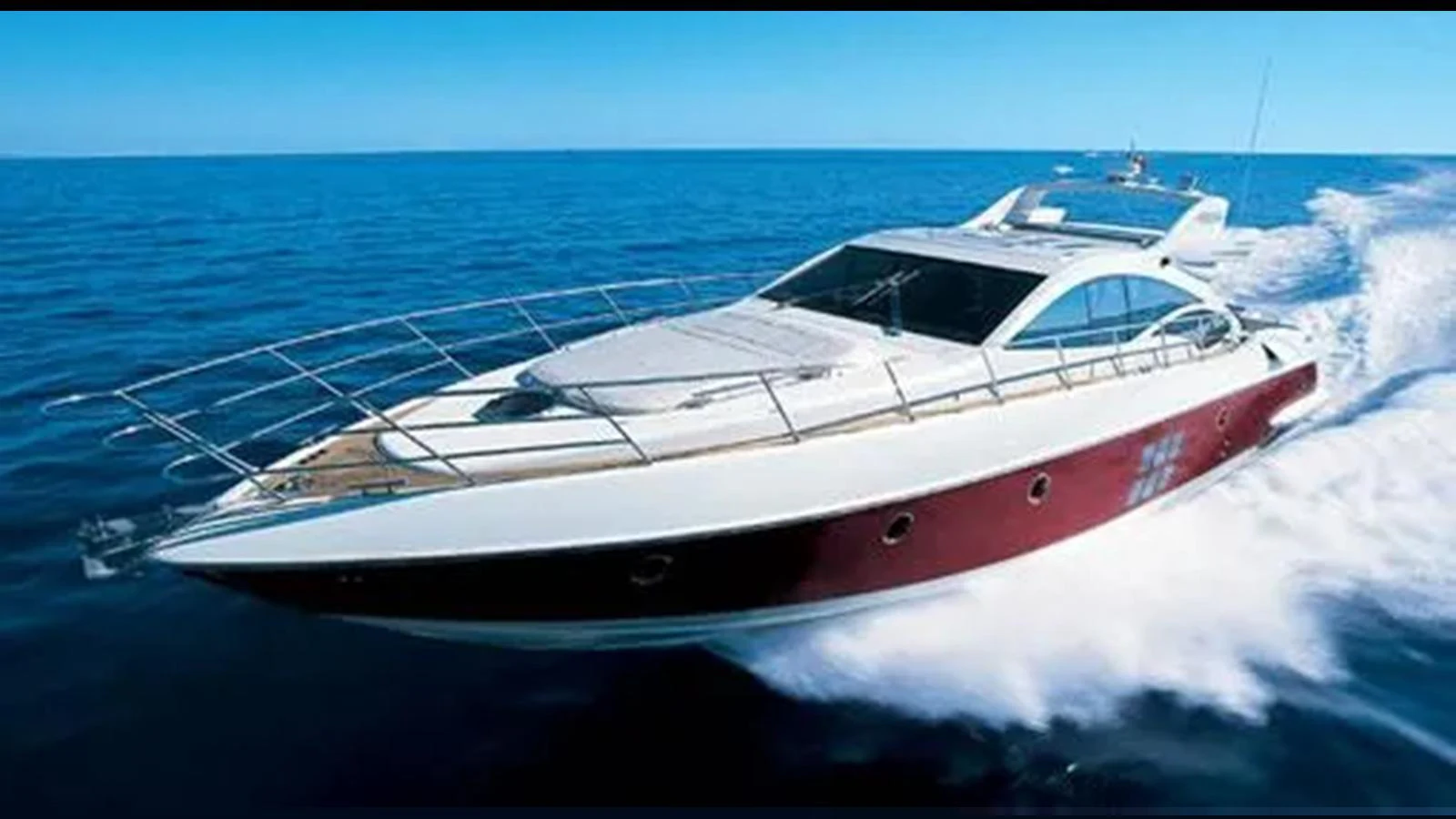 A sleek and modern yacht glides swiftly across the open sea, showcasing its elegant design and powerful performance. aboard 2007 AZIMUT 68S Yacht for Sale