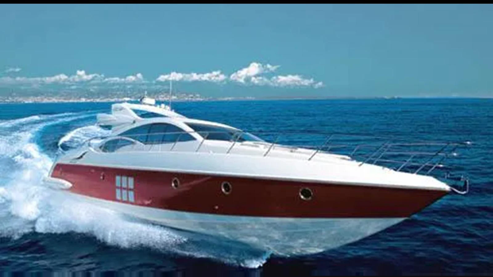 A sleek, modern yacht cruises swiftly across the open sea under a clear blue sky. aboard 2007 AZIMUT 68S Yacht for Sale