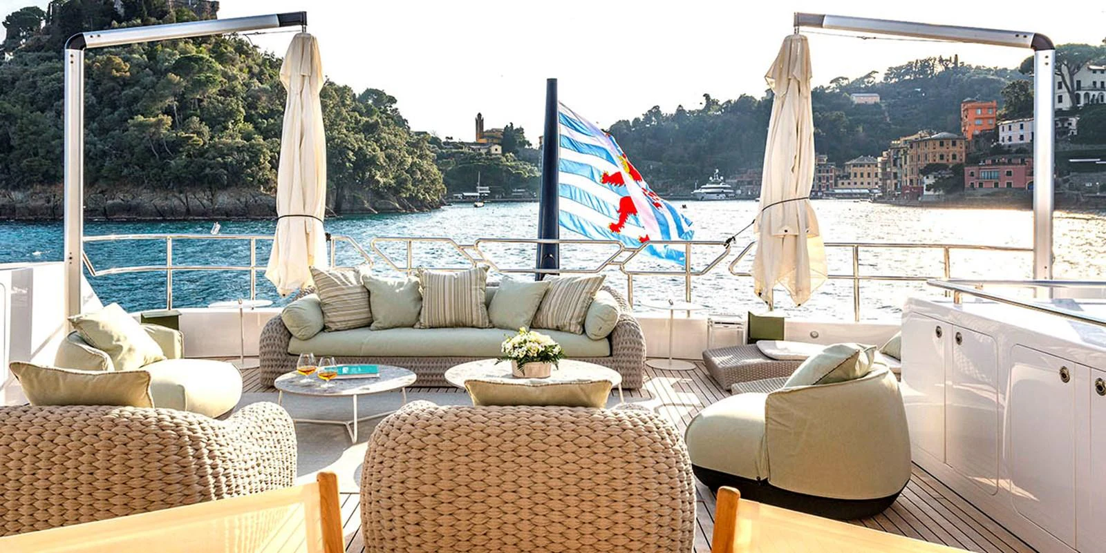 The aft deck offers a luxurious outdoor seating area with stunning views of the surrounding waters. aboard UNEXPECTED Yacht for Sale