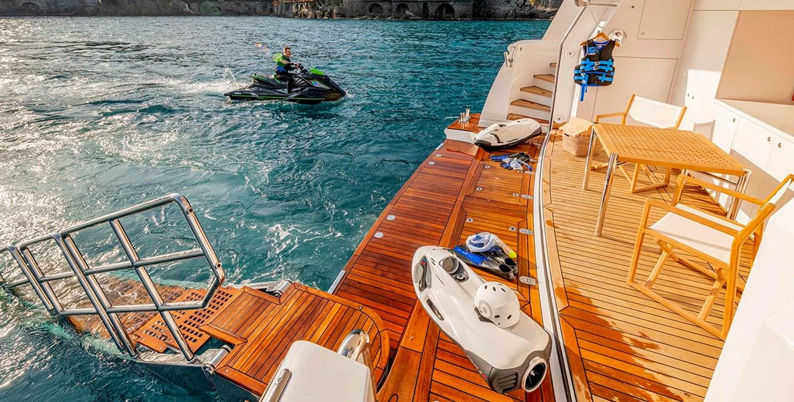 The yacht's swim platform offers easy access to the water and features a comfortable seating area for relaxation. aboard UNEXPECTED Yacht for Sale