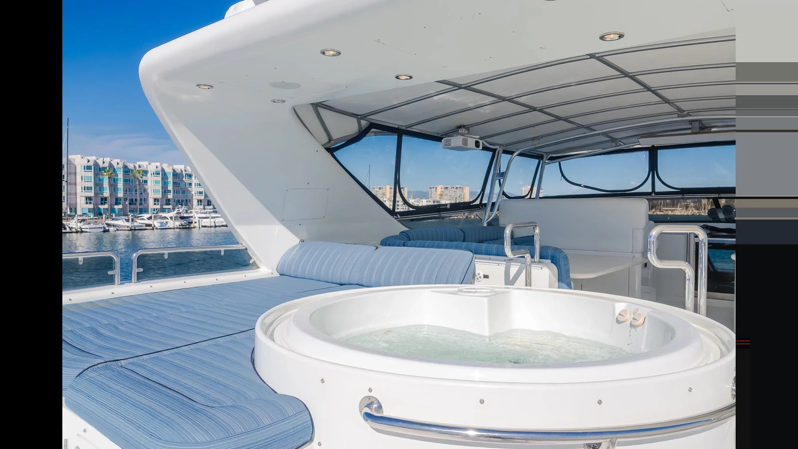 The sundeck features a luxurious hot tub with ample seating and a retractable roof for ultimate relaxation. aboard ACTIVE OCTO Yacht for Sale