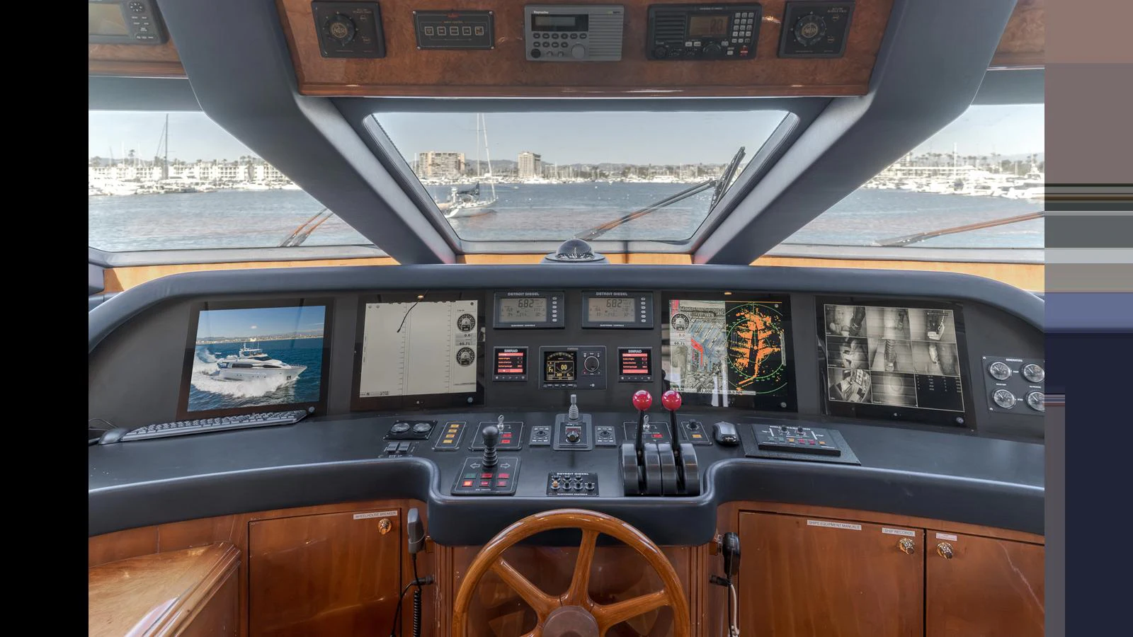 The helm station offers a commanding view with advanced navigation and control systems. aboard ACTIVE OCTO Yacht for Sale