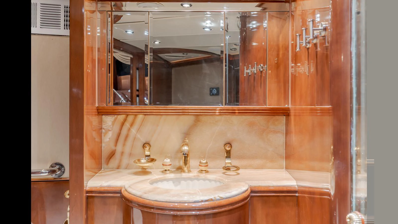 The yacht's bathroom features elegant wood paneling and luxurious fixtures. aboard ACTIVE OCTO Yacht for Sale
