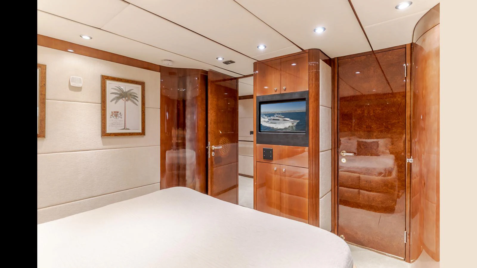 A luxurious stateroom featuring elegant wood finishes and modern amenities. aboard ACTIVE OCTO Yacht for Sale