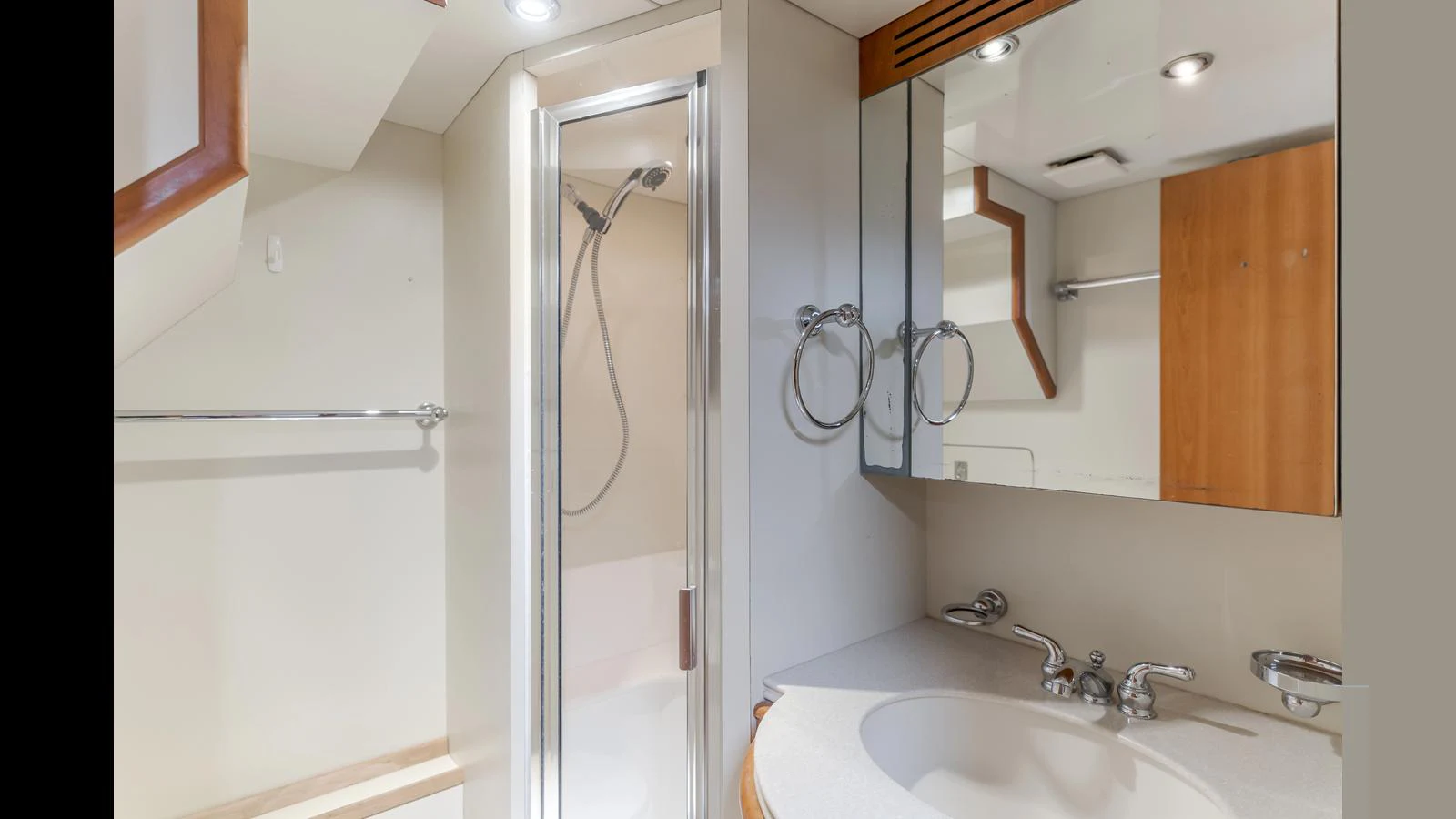 The yacht's bathroom features a sleek shower and a modern vanity area. aboard ACTIVE OCTO Yacht for Sale