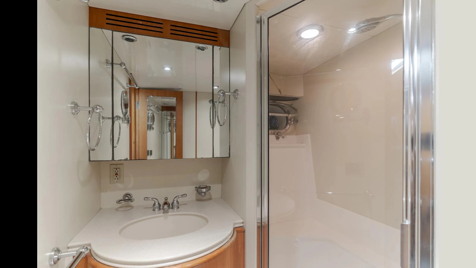 The yacht's bathroom features a sleek vanity with a large mirror and a spacious shower area. aboard ACTIVE OCTO Yacht for Sale
