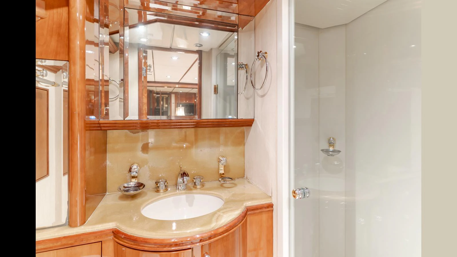 The yacht's bathroom features elegant wood finishes and a sleek, modern design. aboard ACTIVE OCTO Yacht for Sale