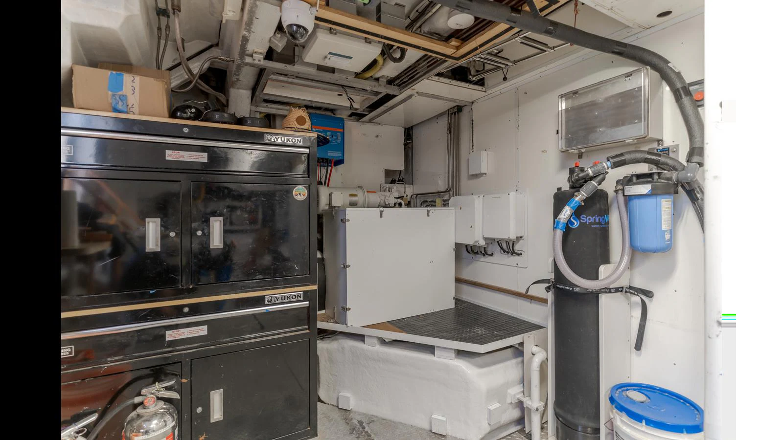 The image showcases the engine room with various technical equipment and storage units. aboard ACTIVE OCTO Yacht for Sale