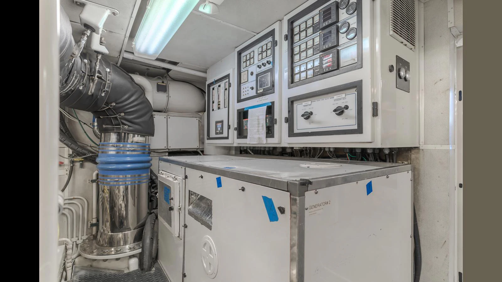 The image showcases the yacht's well-maintained engine room with advanced control panels and machinery. aboard ACTIVE OCTO Yacht for Sale