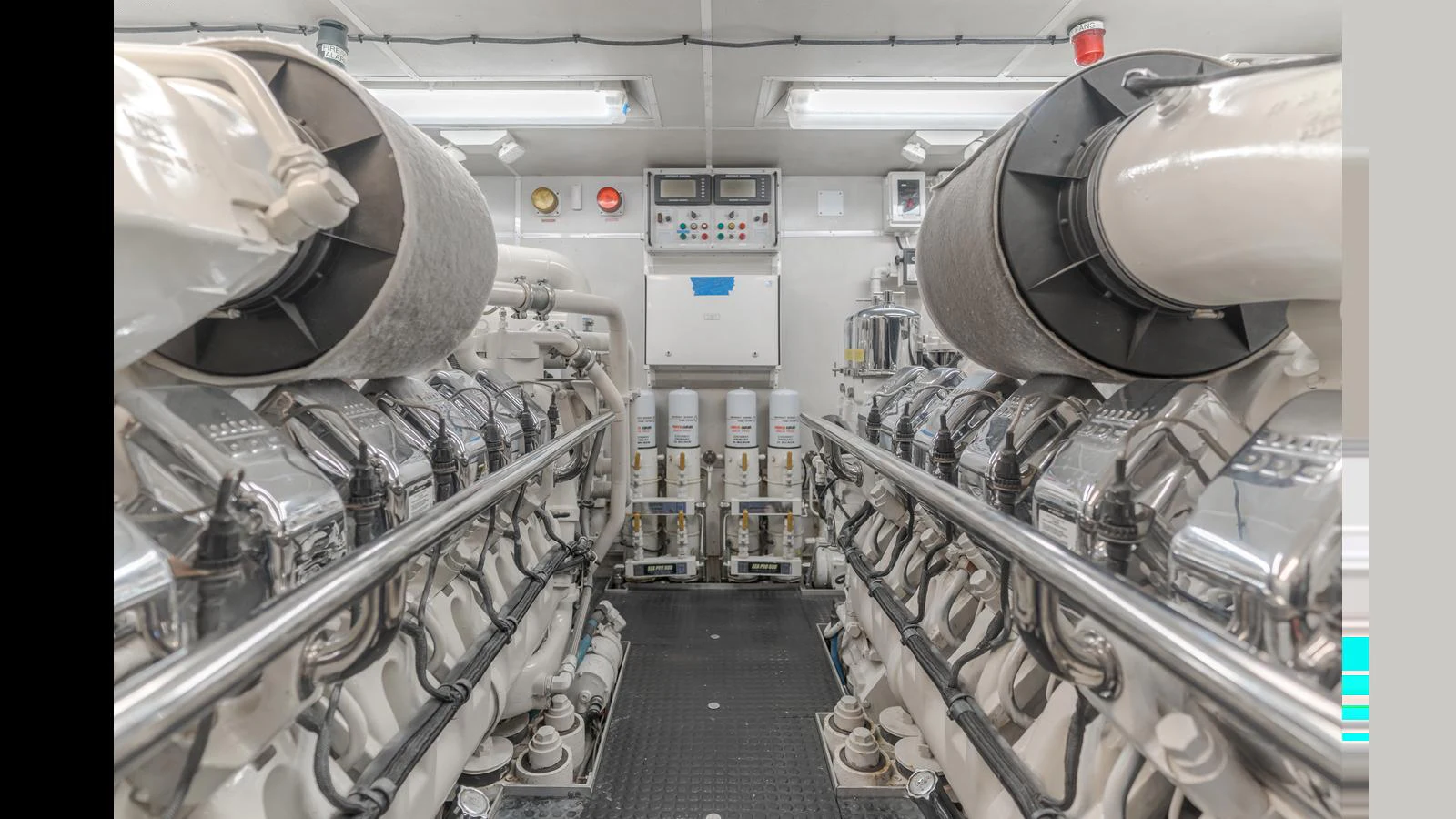 The yacht's engine room showcases a pristine and well-organized mechanical space. aboard ACTIVE OCTO Yacht for Sale