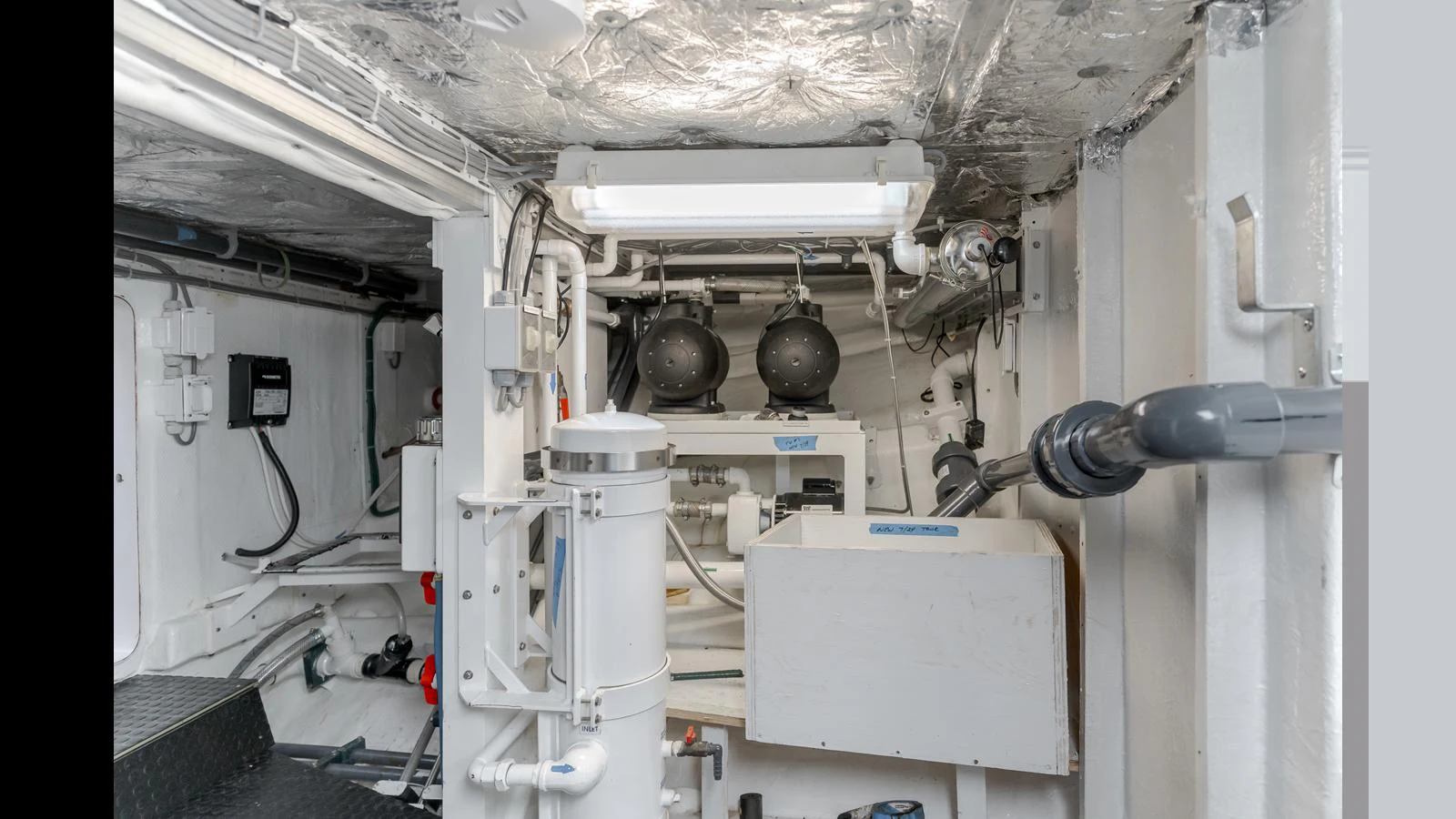 The image showcases the yacht's engine room with various mechanical and electrical components. aboard ACTIVE OCTO Yacht for Sale