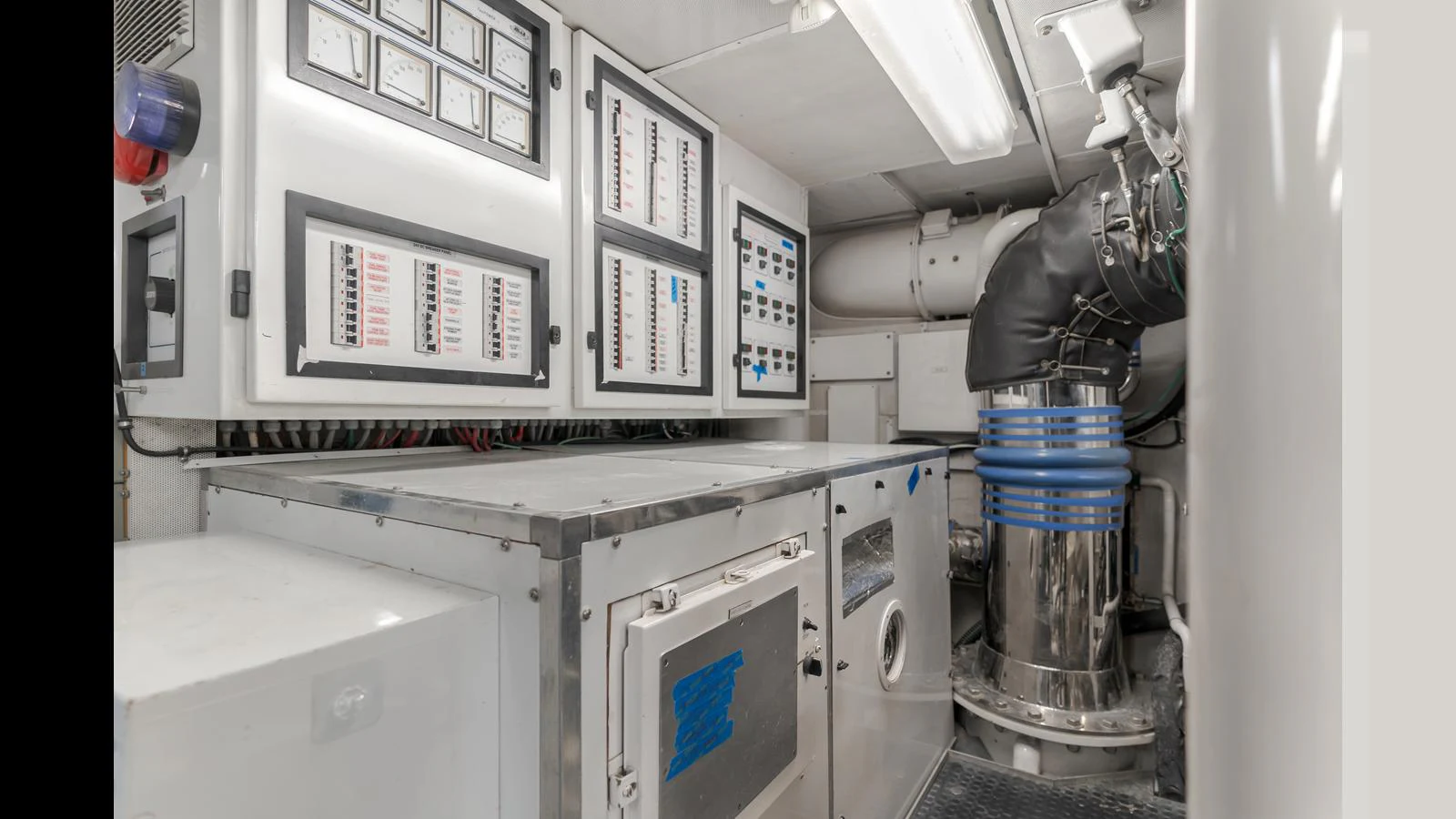 The yacht's engine room showcases a well-organized control panel and machinery. aboard ACTIVE OCTO Yacht for Sale
