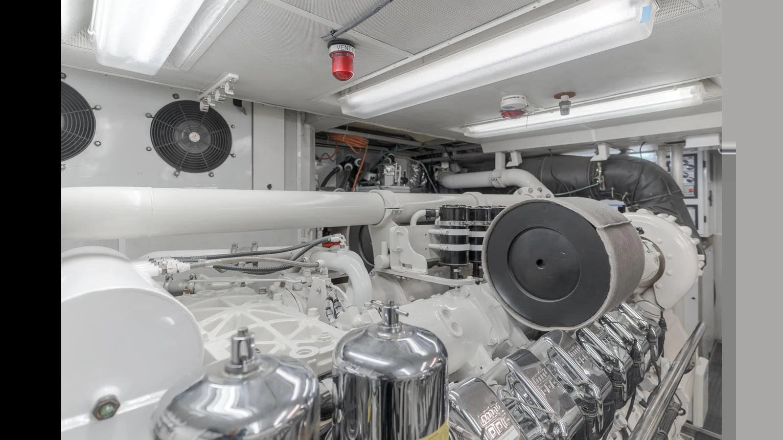 The image showcases the pristine and well-maintained engine room of the yacht, highlighting its powerful machinery. aboard ACTIVE OCTO Yacht for Sale