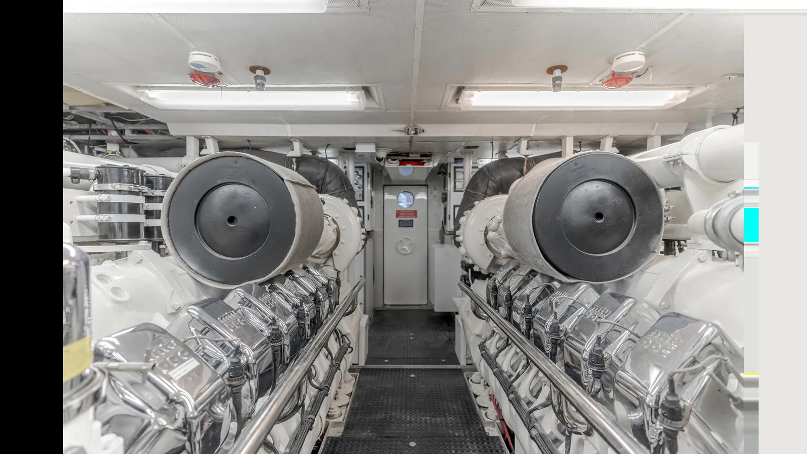 The engine room showcases powerful, well-maintained machinery essential for the yacht's performance. aboard ACTIVE OCTO Yacht for Sale