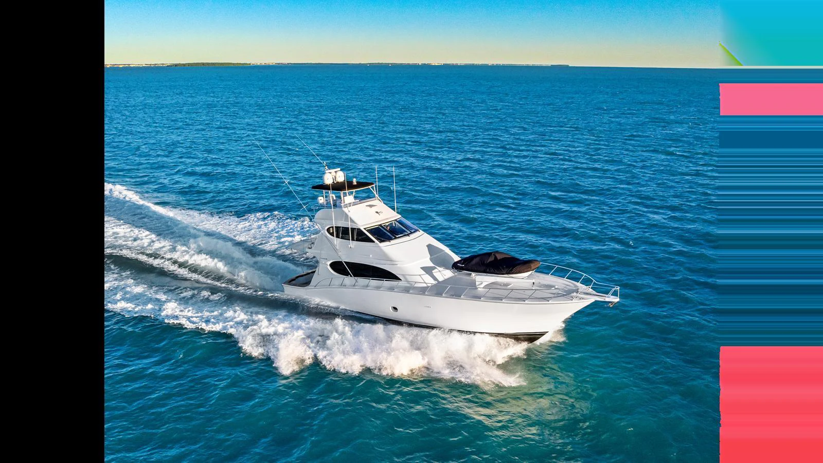 A sleek white yacht cruising swiftly on a clear blue sea under a bright sky. aboard FIRTH'S CHASM Yacht for Sale