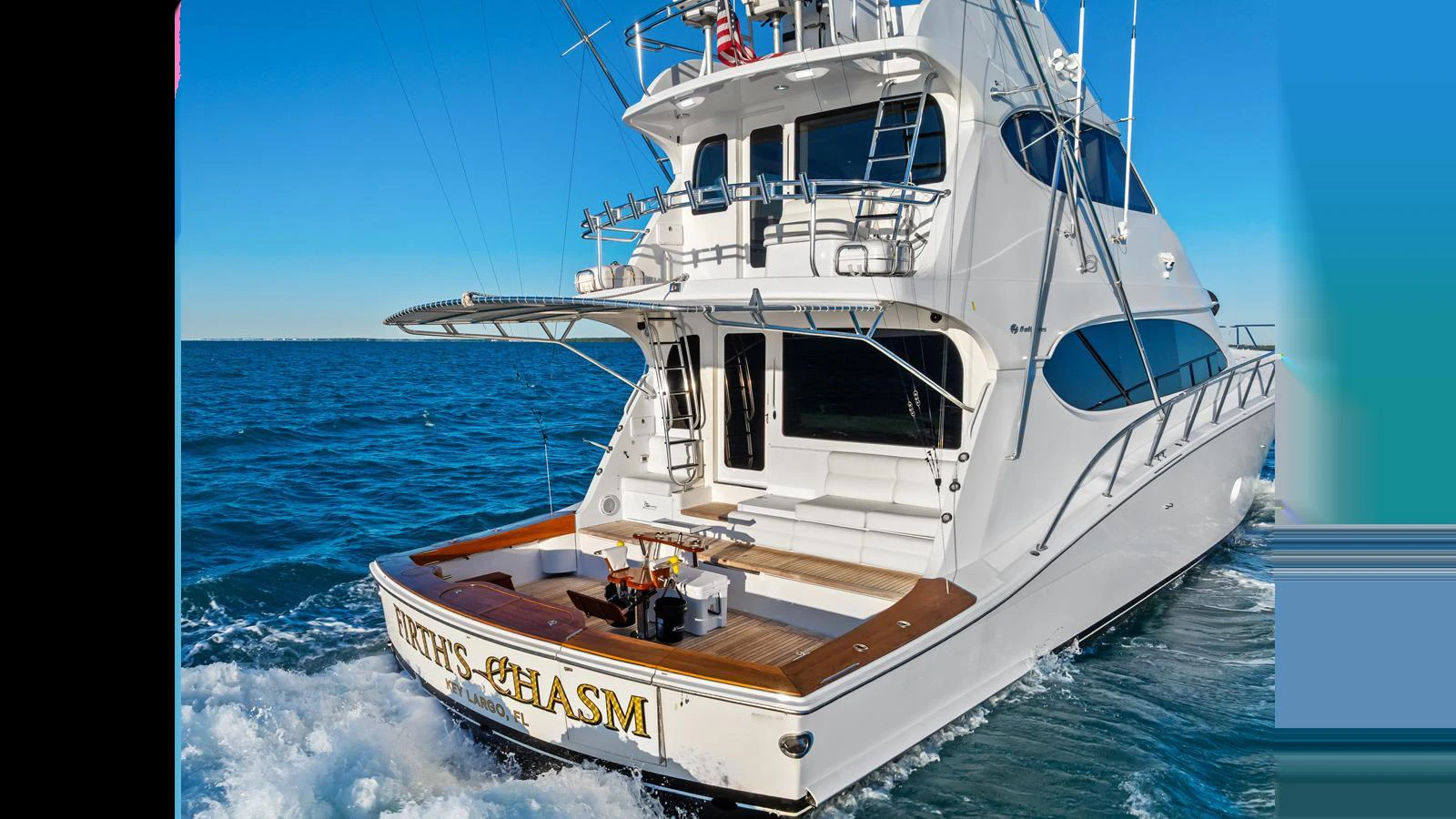 A sleek yacht cruising on the open water with a spacious aft deck. aboard FIRTH'S CHASM Yacht for Sale