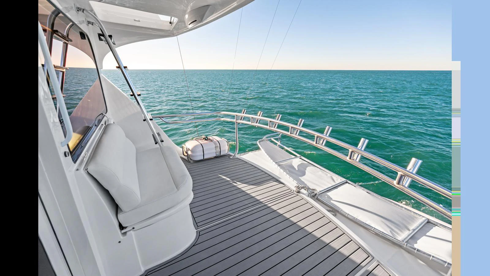 The aft deck offers a serene view of the open sea with comfortable seating and ample space for relaxation. aboard FIRTH'S CHASM Yacht for Sale