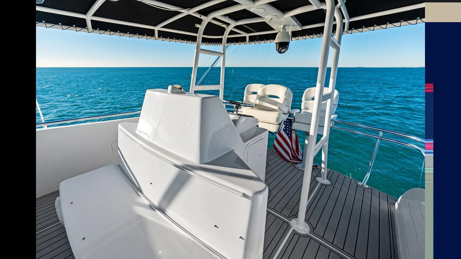The flybridge offers a spacious and shaded area with stunning ocean views. aboard FIRTH'S CHASM Yacht for Sale