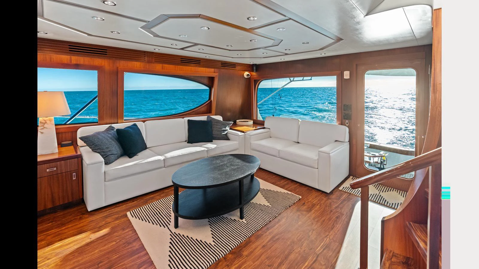 The salon offers a spacious and elegant area with comfortable seating and panoramic ocean views. aboard FIRTH'S CHASM Yacht for Sale