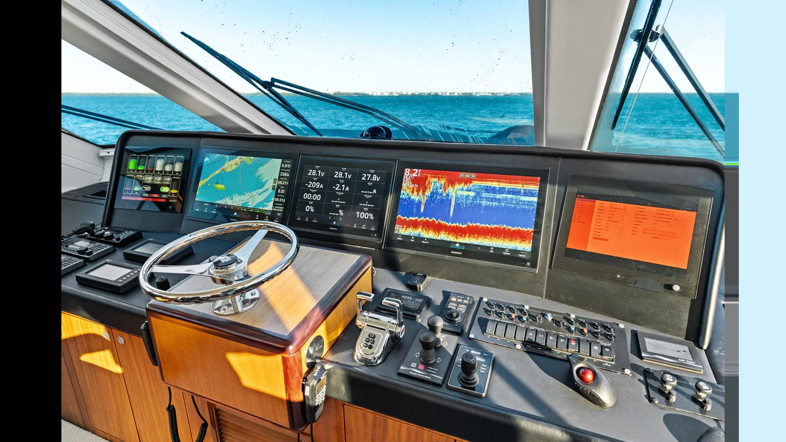 The helm station features advanced navigation and control systems with a panoramic view of the sea. aboard FIRTH'S CHASM Yacht for Sale