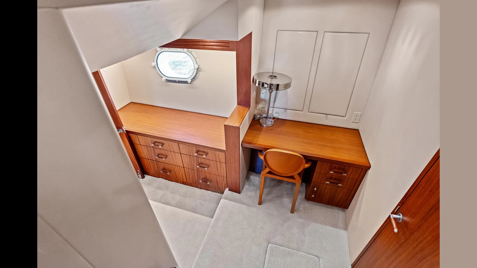 A cozy yacht office space with a desk and ample storage. aboard FIRTH'S CHASM Yacht for Sale