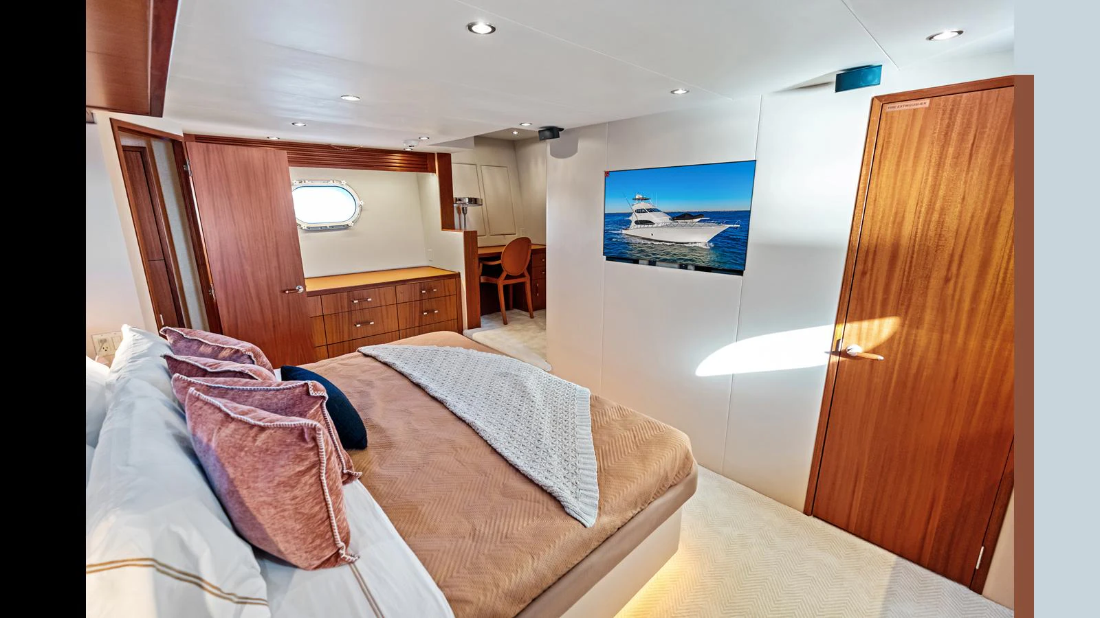 The master stateroom offers a spacious and luxurious retreat with elegant wood finishes and modern amenities. aboard FIRTH'S CHASM Yacht for Sale