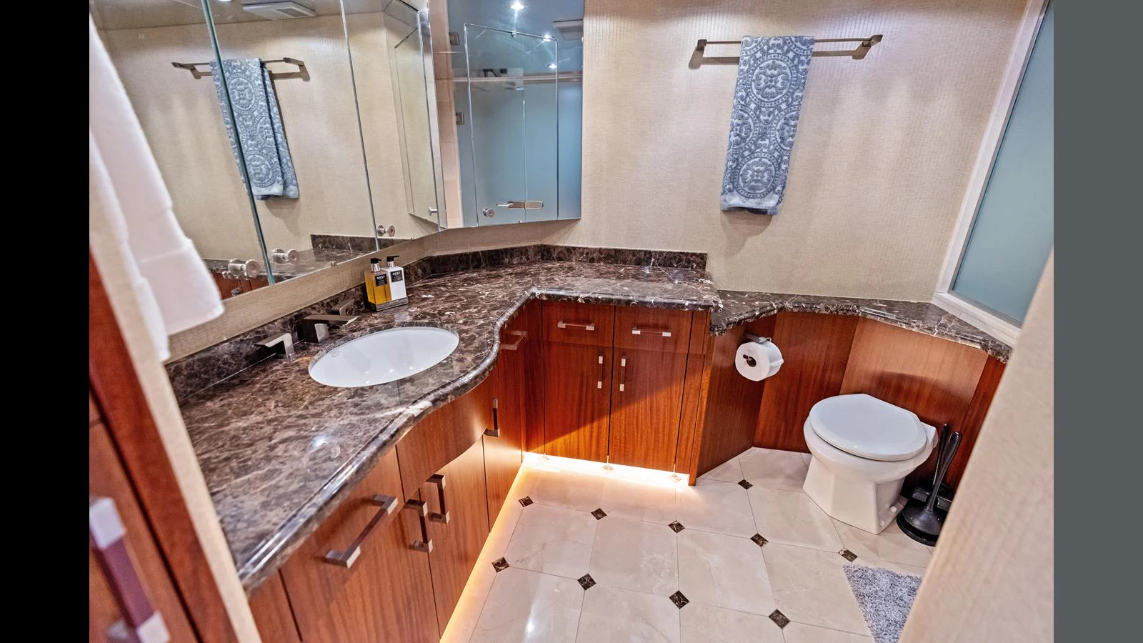 The yacht's bathroom features elegant marble countertops and modern fixtures. aboard FIRTH'S CHASM Yacht for Sale