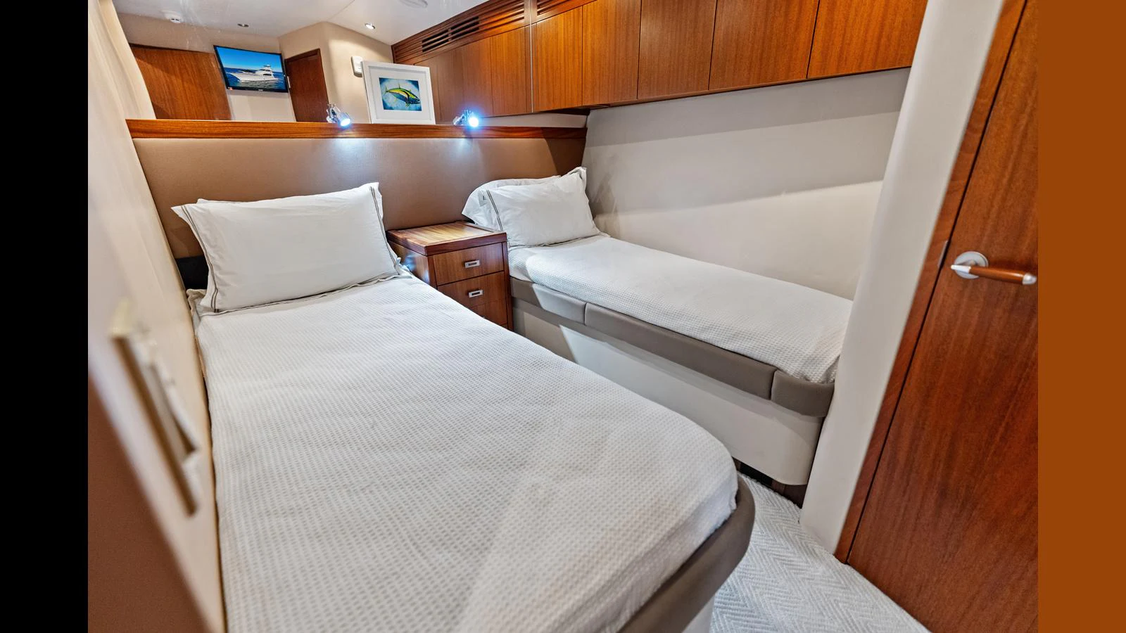 The guest stateroom features twin beds with warm wood finishes and soft lighting. aboard FIRTH'S CHASM Yacht for Sale