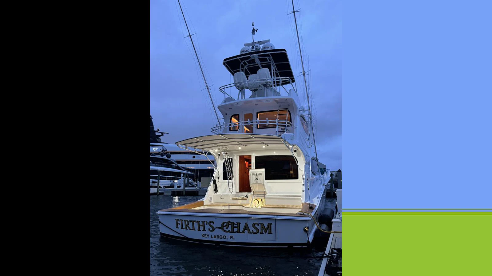 The yacht's aft deck is illuminated in the evening, showcasing its inviting outdoor space. aboard FIRTH'S CHASM Yacht for Sale