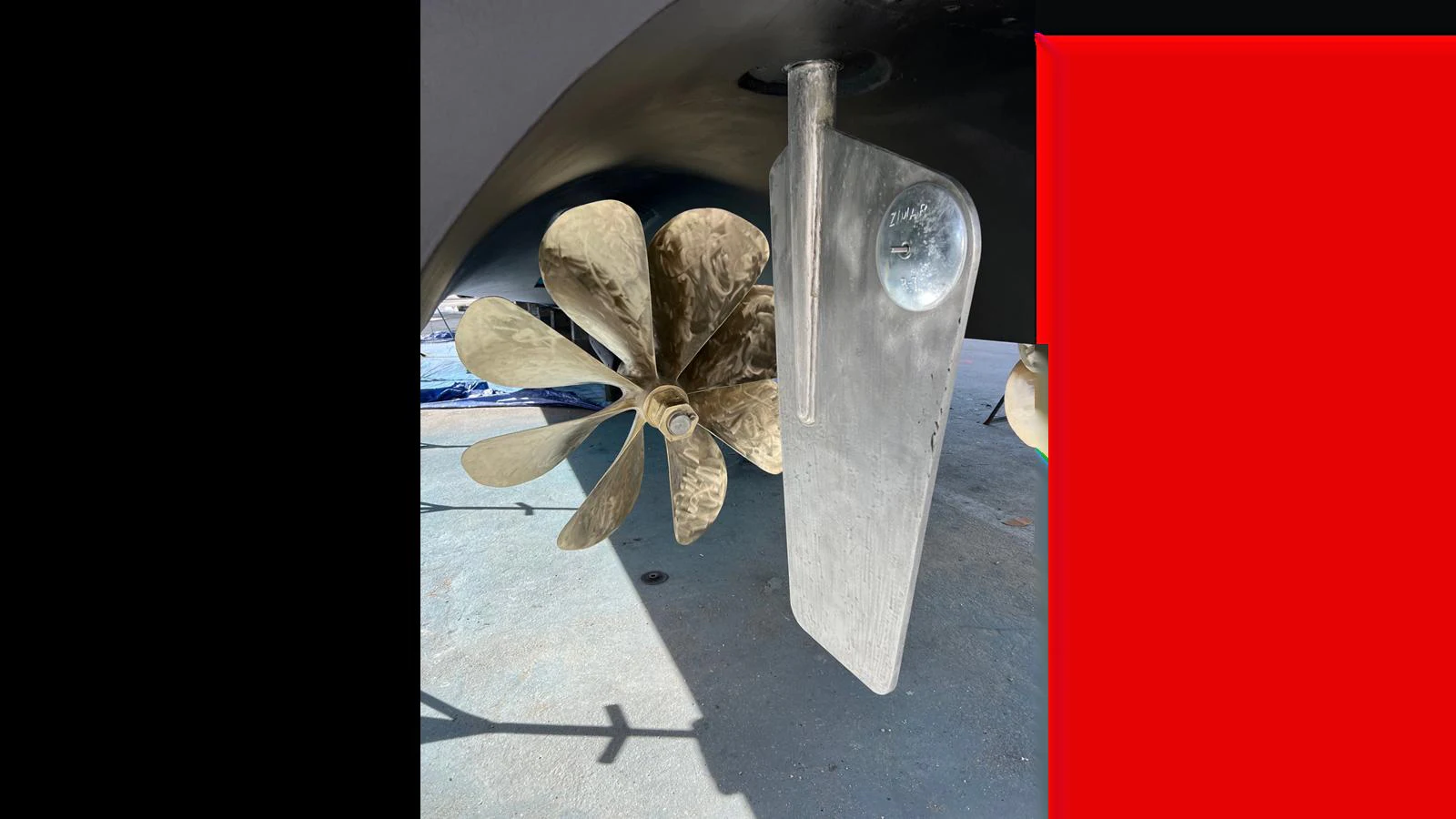 A close-up view of the yacht's propeller and rudder, showcasing the engineering details. aboard FIRTH'S CHASM Yacht for Sale