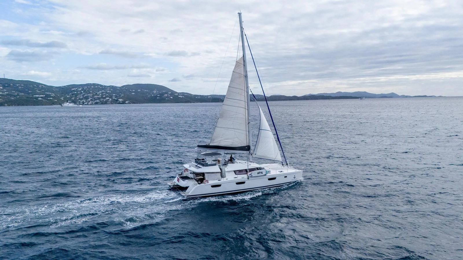a sailboat on the water aboard TRUE STORY Yacht for Sale