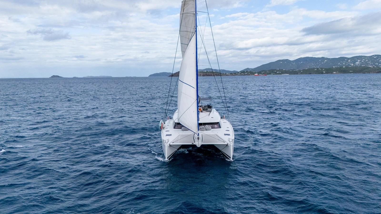 a white boat in the water aboard TRUE STORY Yacht for Sale